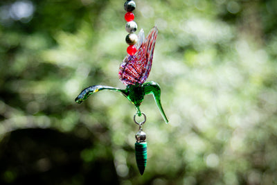 hummingbird with malachite pendant